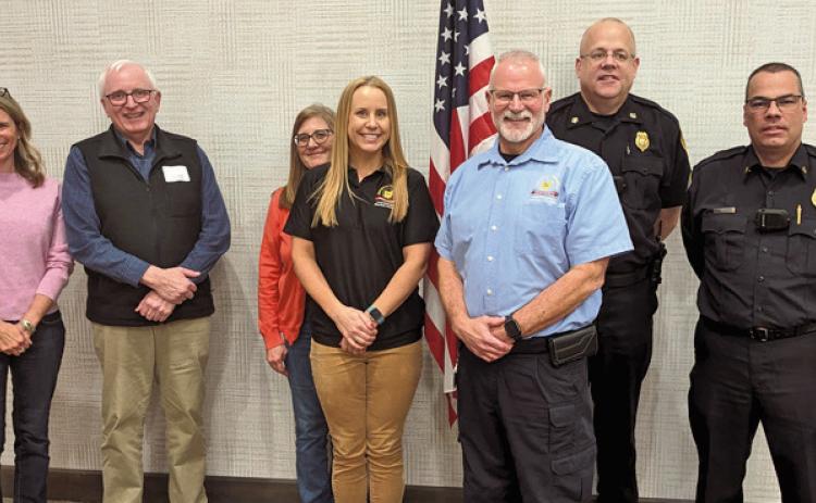 Wood County EMA Director Jeff Klein, forefront, is joined by Perrysburg Township fire, chamber and Perrysburg city council members. At the February luncheon, Mr. Klein spoke about the county’s plans to handle the expected influx of people for the April 8 eclipse.