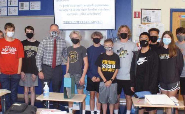 Mr. Cookson enjoys speaking Spanish with students in the same room in which he taught from 1999 to 2009.