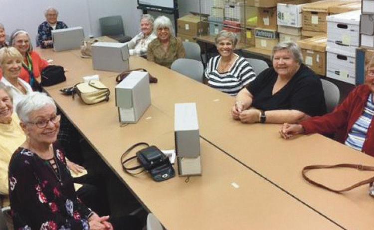 New Century Club members during their visit to the Center for Archival Collections at Bowling Green State University are clockwise from front left: Ricki Rudey, Helen Haas, Sue Stevenson, Wava Hawker, Dee Kroger, Kathy Helmick, Kathy Jarosz, Joanne West, Darlene Limmer, Pat Jacobsen and Doris Currie.