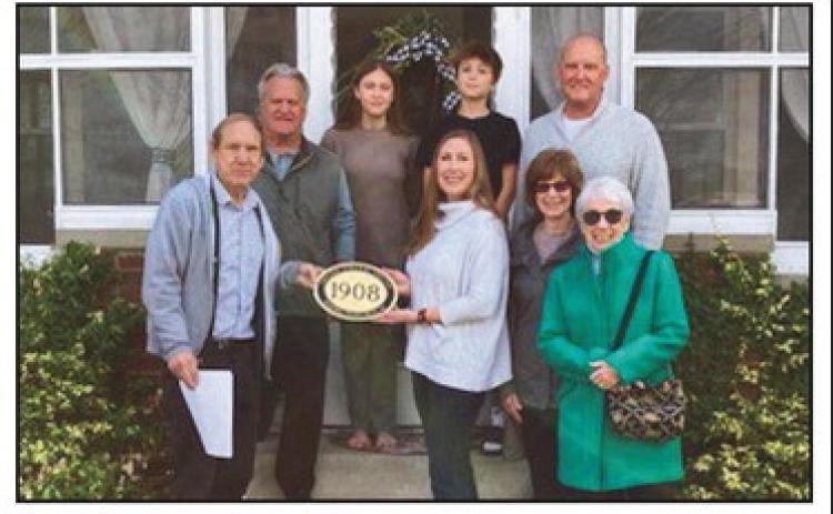 Historic house honored with plaque