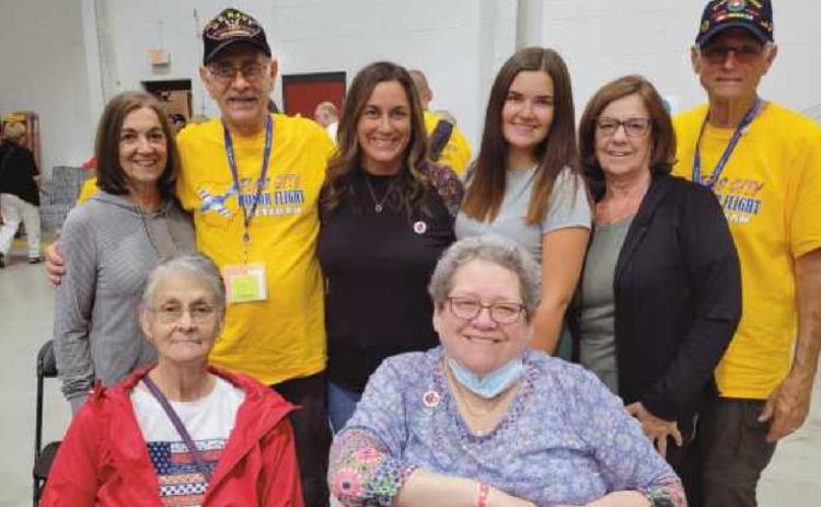 Veteran Robert Schwartz of Perrysburg and his brother-in-law veteran Todd Kissel of California, in yellow shirts, with their family members.