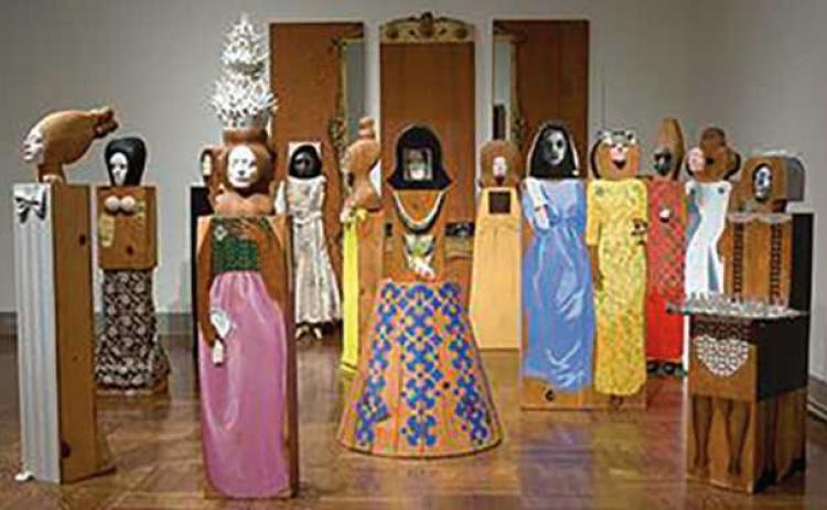 Marisol, “The Party,” assemblage of 15 freestanding, life-size figures and three wall panels, with painted wood and carved wood, mirrors, plastic, television set, clothes, shoes, glasses and other accessories.