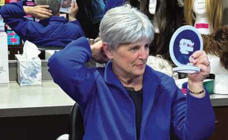 Peggy Keyes tries on her new wig.