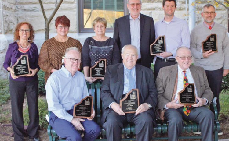 Recipients of the 2021 Spirit of Wood County awards are, seated from left, Robert Bettinger, Lyle R. Fletcher Good Citizenship, and Jack Jones and Walt Churchill Jr., industrial and economic development. Back row from left, Beatriz Maya, liberty through law and human freedom; Deb Archambo, education for civic responsibility; Irma Wolf, selfgovernment; Les and Scott Buker, posthumously for Deb Buker, Lyle R. Fletcher Good Citizenship, and Alan Sundermeier, agricultural leadership.