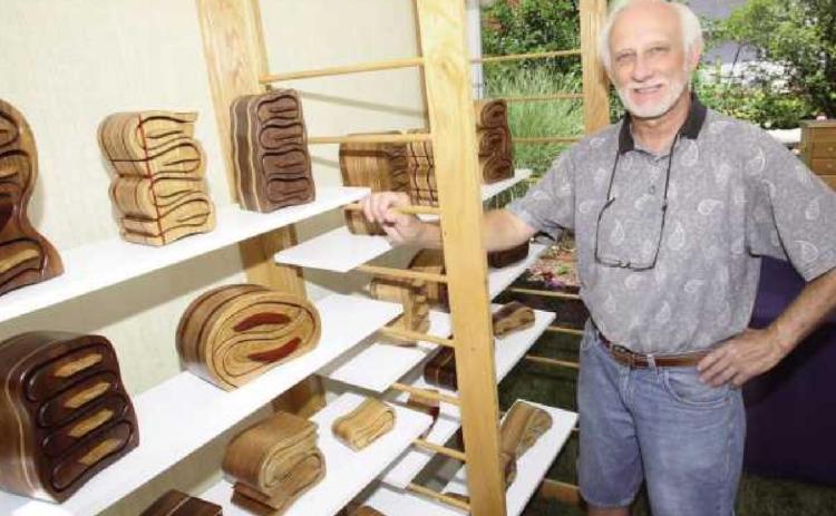 Dave Grabarczyk in his studio with some pieces he made to use as models for photos that appear in his book on making bandsaw boxes.