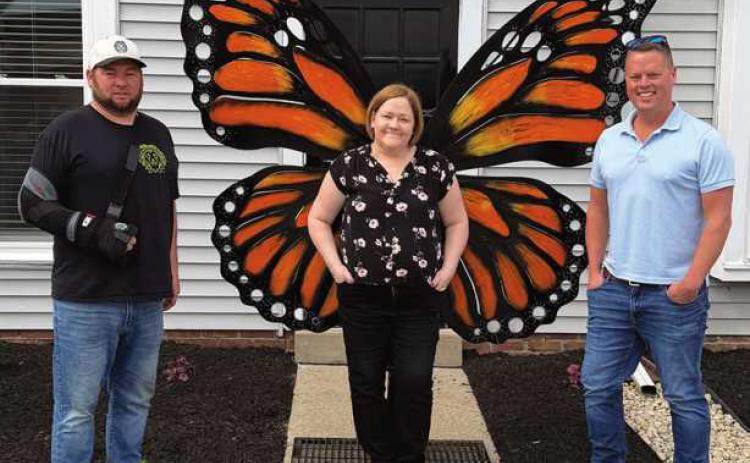 Sculptor Jeff Drushal with Monarch Grief Center co-founders Amy Rowe and Tim Polakowski.