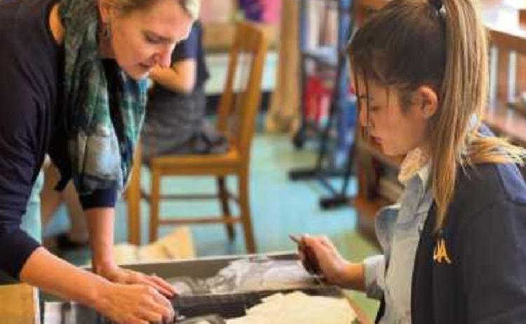 NDA art department chair Susan Kozal with a visual arts student.