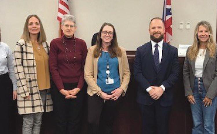 Pictured from left, are: Kristen Leverton, Court Appointed Special Advocates program director, with new CASA volunteers Natalie Reichert of Bowling Green, Shanna Gerken of Bowling Green, Patricia Smith of Perrysburg, Kristina Eynon of Bowling Green, Ryan Wright of Perrysburg, Lisa Riddle of Perrysburg, and Judge Dave Woessner.