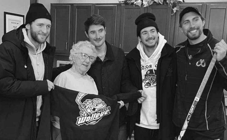 Pictured at the Tree of Dreams program presentation are, from left: Toledo Walleye player Chase Gresock, Waterford resident Ginny Storey, and Walleye players Will Cullen, Brandon Cruse and Sam Craggs.