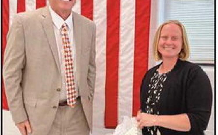 On June 20, the Perrysburg board of education recognized outgoing Perrysburg Education Association president Margaret Bernard, above, right, with Superintendent Tom Hosler, for her service. During her tenure, she faced “unprecedented challenges,” noted Mr. Hosler, adding, “She provided excellent leadership not only to her members but to the entire district.”