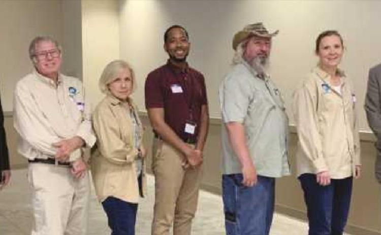 Accepting the award were members of Perrysburg’s Street Tree Commission. They are from left: Tyler Stevenson, urban forestry coordinator; Jim Hagen, Christine Ardley, Mark Easterling, Scott Kirby, Kali Sawaya and Dan Balser, ODNR division of forestry chief.