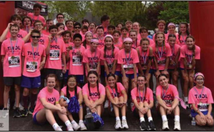 Saint Rose Middle School recently hosted its annual Teen High On Life week. Students celebrated their faith, served their community, learned from guest speakers about the issues facing students their age, and competed in either the sixth grade two-mile run or the seventh/eighth grade 5K. Pictured are students at the conclusion of the week’s festivities.