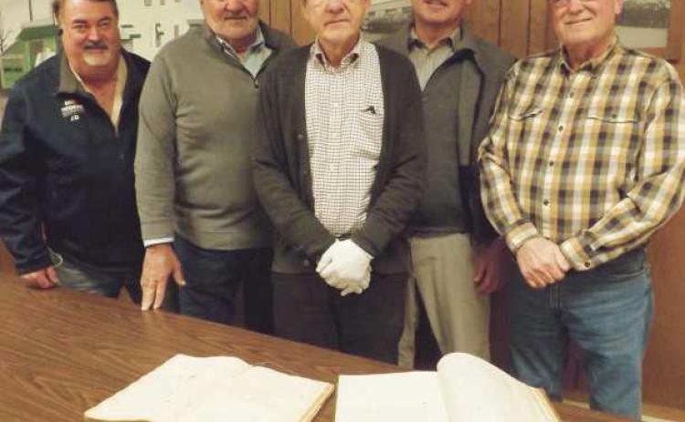 Plans are afoot for Perrysburg Township’s bicentennial in 2023. Pictured from left are: Jeff Justus, committee chairman; township trustees, Joe Schaller, Bob Mack, and Gary Britten. At center, Way Public Library local history librarian and committee co-chairman Richard Baranowski displays two township historical record books.