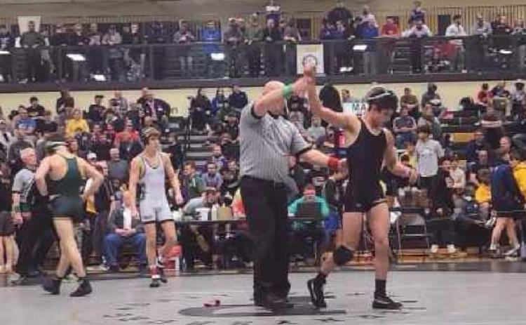 Above: Ryan Avalos gets a semifinal victory over Lakewood St. Edward.