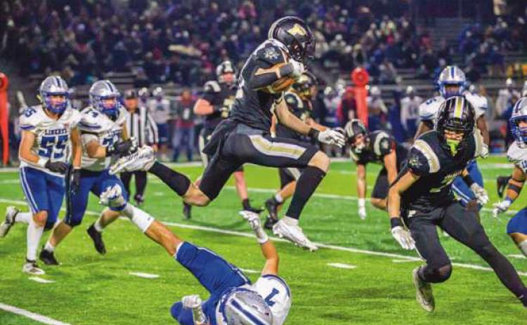 Olentangy Liberty’s strong defense kept the Yellow Jackets out of the endzone and performing aerial leaps to gain yardage.