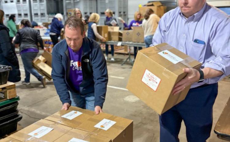 Volunteers assembled the holiday food boxes.