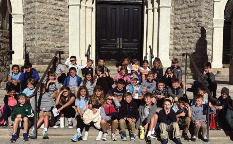Saint Rose third grade students recently completed a walking tour of historic Perrysburg. They were assigned different historical buildings around Perrysburg. They conducted research about the building and the early founders. In mid-October, they then explored Perrysburg with their teachers. Each student shared his or her research information with classmates in front of each building. The beautiful weather made for a very pleasant day to learn about the history of the community.