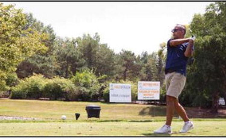 Jameel Burkett, president and CEO of Burkett Restaurant Equipment &amp; Supplies, tees off.