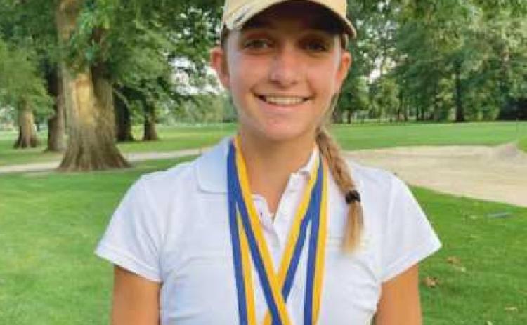 Sydney with two medals from a previous contest.