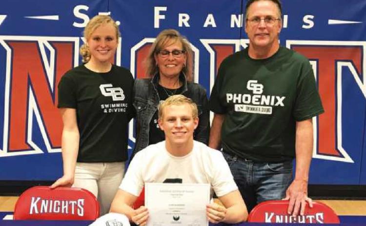 John Burnard with his sister Meghan, left, and parents Michelle and Jim during the signing ceremony at St. Francis High School.
