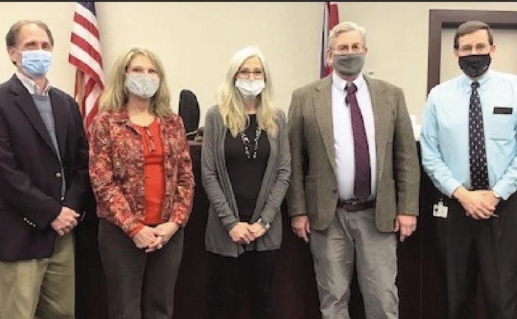 From left: Mike Godfrey, Sallie Gardner, Linda Hammer and Steve Heckler with Judge Woessner.