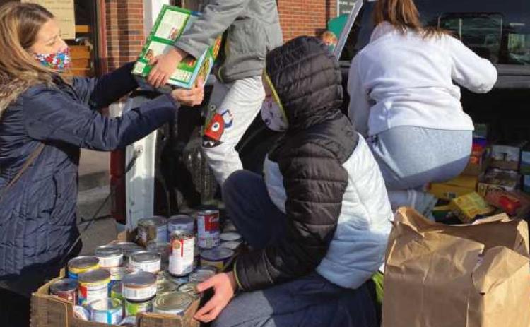 St. John XXIII community donates to Helping Hands