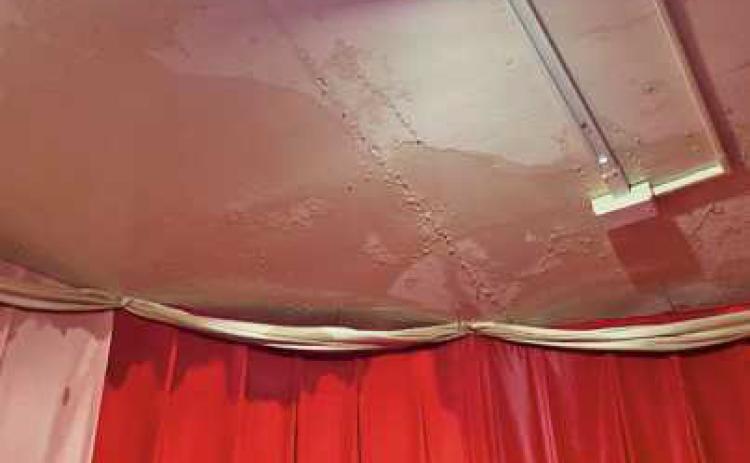 Water can be seen seeping through the ceiling.