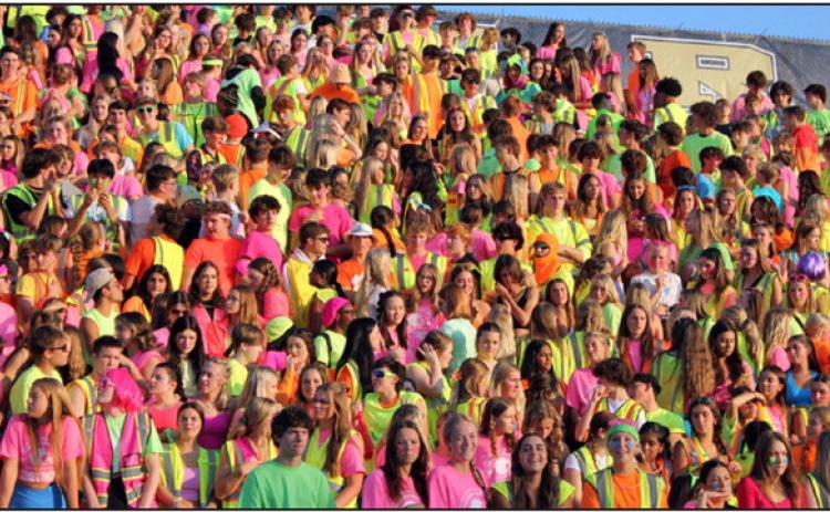 Above, Perrysburg students filled the stands with color in their neon spirit wear. Below, members of the 2023 Homecoming Court are pictured after the crowning of Homecoming queen and king, Sydney Daudelin and Jack Bowe. The royalty received their crowns from last year’s queen and king, Maci Maxwell and Andrew Becks.