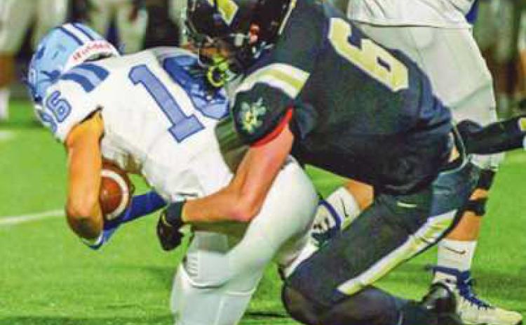 Linebacker Avery Hunt tackles tight end Jared Moeller.