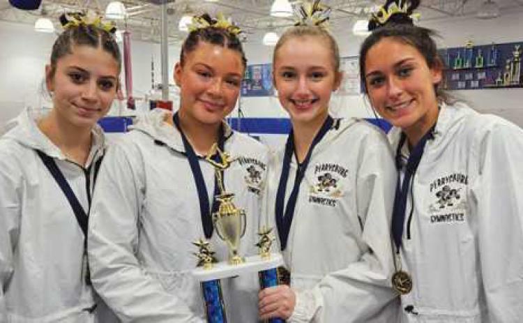First place finishers, from left to right: Lillian Wood (bars), Kylee Ruiz (vault), Janie Snyder (beam) and Emily Maines (floor).