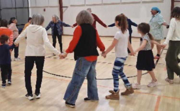Participants enjoying the community contra dance.