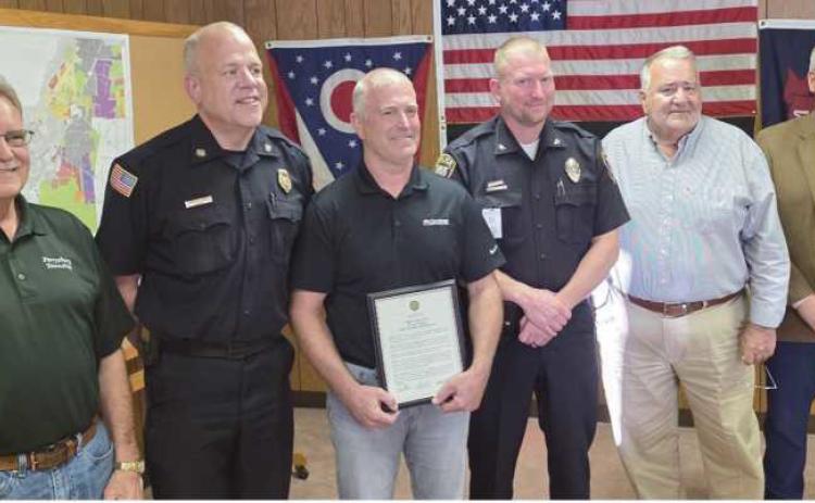 From left: Trustee Gary Britten, Fire Chief Tom Brice, Phil Eisel, Police Chief Matt Gazarek, Trustee Joe Schaller and Trustee Bob Mack.