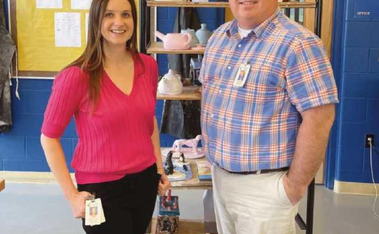 Meghan Yarnell and Don Griffith in front of the kiln cart.