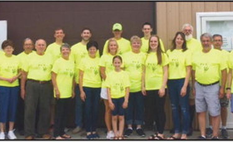 PCU volunteers in front of food pantry.