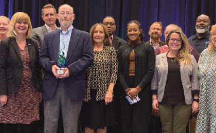 Don Glaza, third from left in the front row, with TARTA personnel at the Ohio Public Transit Association convention.