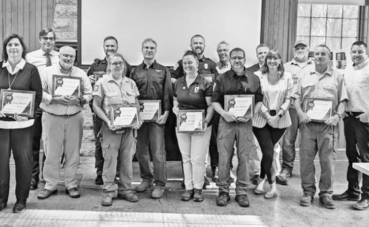 Metroparks commissioners and executive director Dave Zenk recognize employees for attaining milestone anniversaries with the park district.