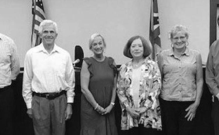 Judge Dave Woessner, far right, administered the oath of office to the five new Court Appointed Special Advocates, from left, Kevin Braun, Travis Chapin, Anne Clark, Eva Zuchowski and Beth Cooksey.