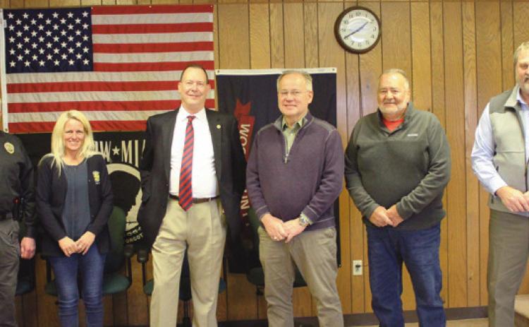 Above from left are Police Chief Mark Hetrick; Kelly Moore, zoning inspector; Walt Celley, retiring administrator; Trustees Bob Mack and Joe Schaller, and Jon Eckel, new administrator.