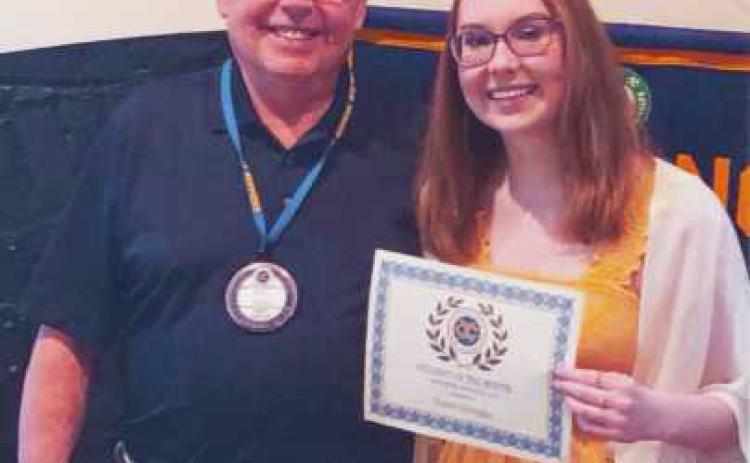 Bill Dupke, second vice president of the club, with May Exchange Club student of the month, Taylor Schwegler.