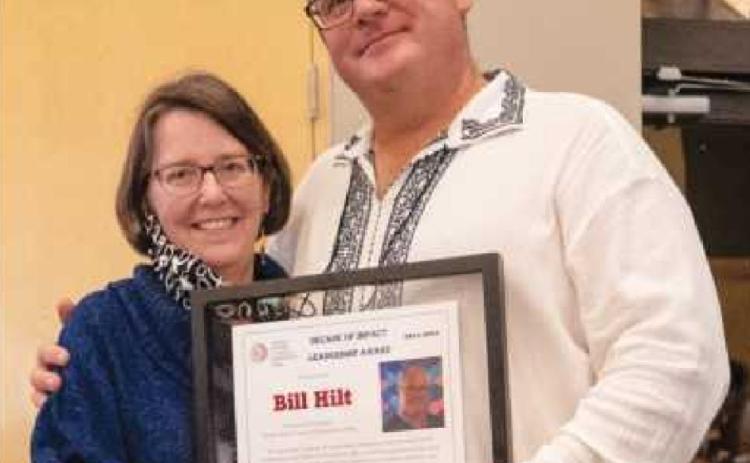 Dr. Nancy Patterson, toastmaster for the awards ceremony and BGSU professor, presented Bill Hilt with the Decade of Impact Leadership Award.