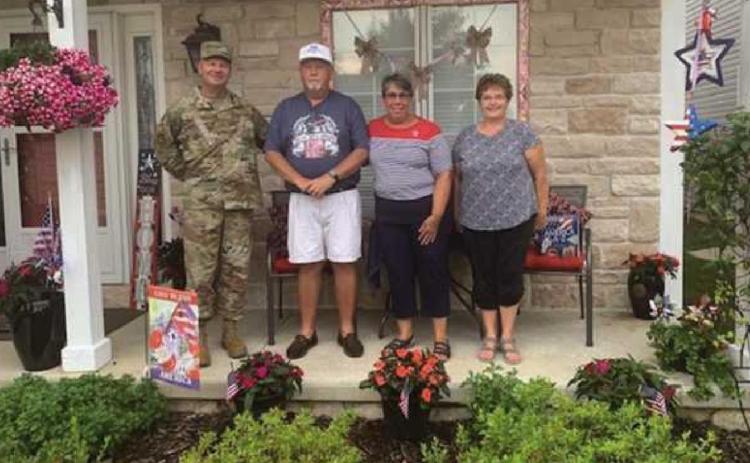 From left, Chief Master Sergeant Michael Bratton, Steve and Kim Simmons, and Bev Simmons.