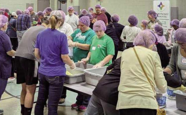 Zoar Lutheran Church packs food with Sew Hope