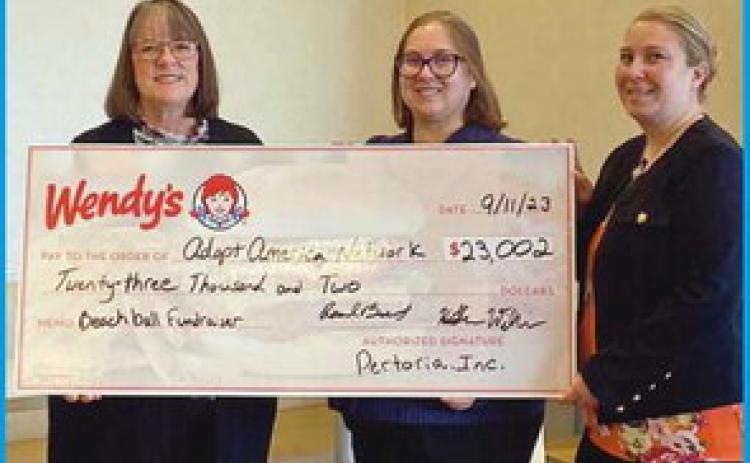Perrysburg Wendy’s presents check to Adopt America Network