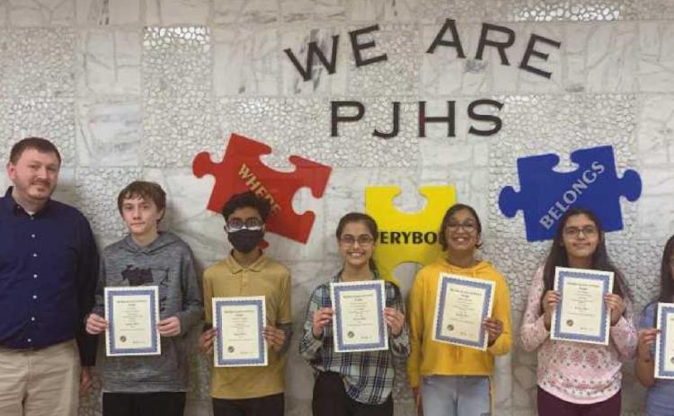 From left are Corbin Brangham, seventh grade science teacher, with Perrysburg Junior High School students AJ Benko, Avnish Shenge, Krisha Raichura, Maanya Parikh, Ria Khatri and Gauri Anil.