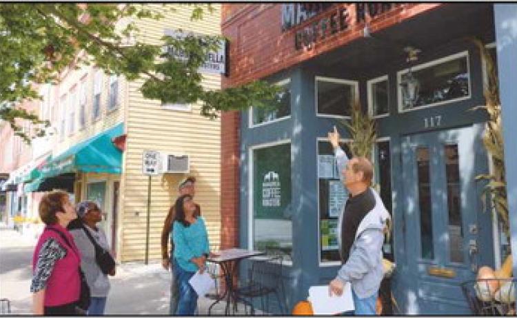 On September 17, Way Public Library Local History Librarian, Richard Baranowski, led an uptown building tour of the 100 block of East Louisiana Avenue. He shared information about building origins and different businesses over the years. Pictured, from left are: Alicia Lipinski, Burma Stewart, Peggy Glunk, Bill Glunk and Mr. Baranowski.