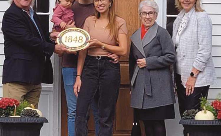 Daniel and Teresa McCartney of 517 East Sixth Street received a plaque from Historic Perrysburg Inc. members, from left, Dave Kleeberger, Mary Smith and Joy Studer. The home was built in 1848.