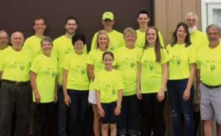 Volunteers worked at the PCU food pantry on June 26 to reorganize and restock the shelves.