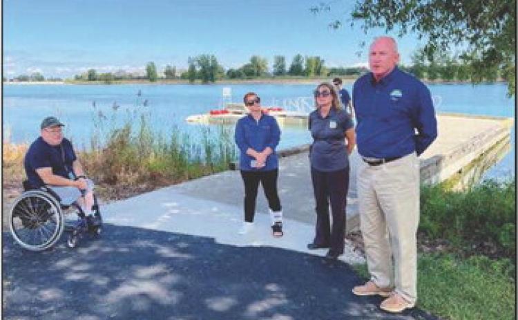 At the unveiling are Gary Peters of west Toledo; Stephanie Merkle, Columbia Gas; Lisa Daris, OSPF and Glen Cobb, ODNR.