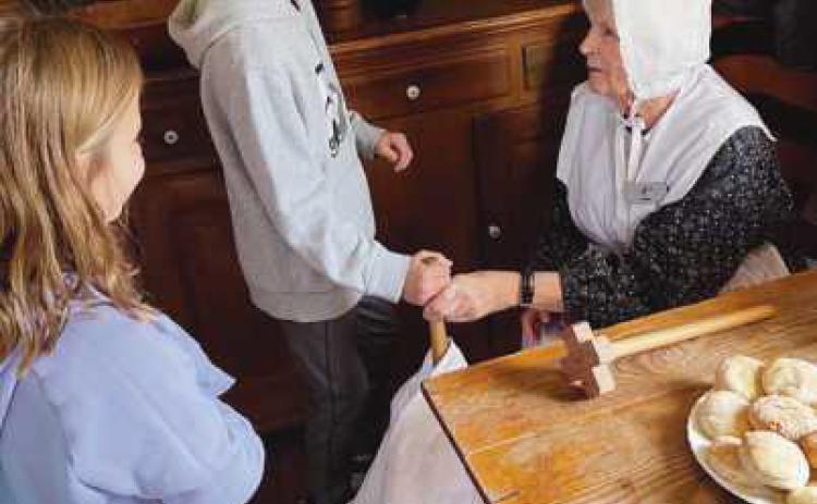 The Saint Rose third grade class recently visited Sauder Village in Archbold. They learned about Native American homes, explored pioneer living, went on a train ride and visited the General Store. Pictured are students enjoying a fun and interactive day.
