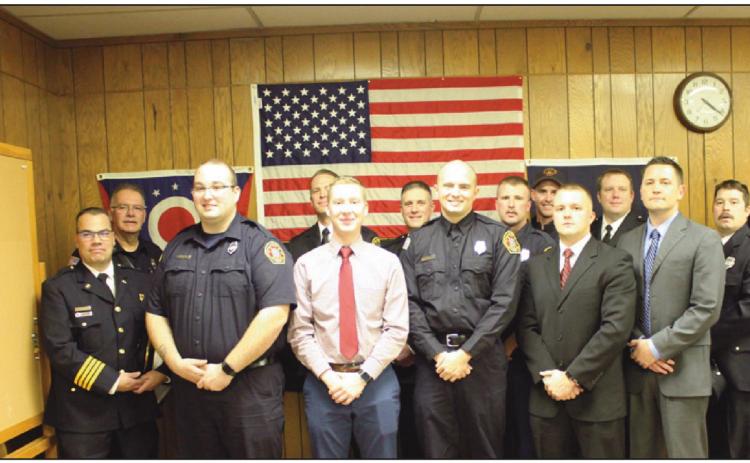 On December 15, five personnel were sworn in to serve the Perrysburg Township Fire Department. They are front row from left, Brian Perkins, Jacob Rands, Joe Gernheuser, Jaren Wickham and Levi Kuebler. Behind them are members of the department and they are flanked by Deputy Chief Jim Rodriguez, back row left and Chief Tom Brice, right.